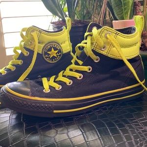 Neon green and black high top converse